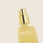 Havéa bond & repair hair oil bottle on a beige background