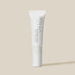 White cosmetic tube with Havéa branding on a beige background
