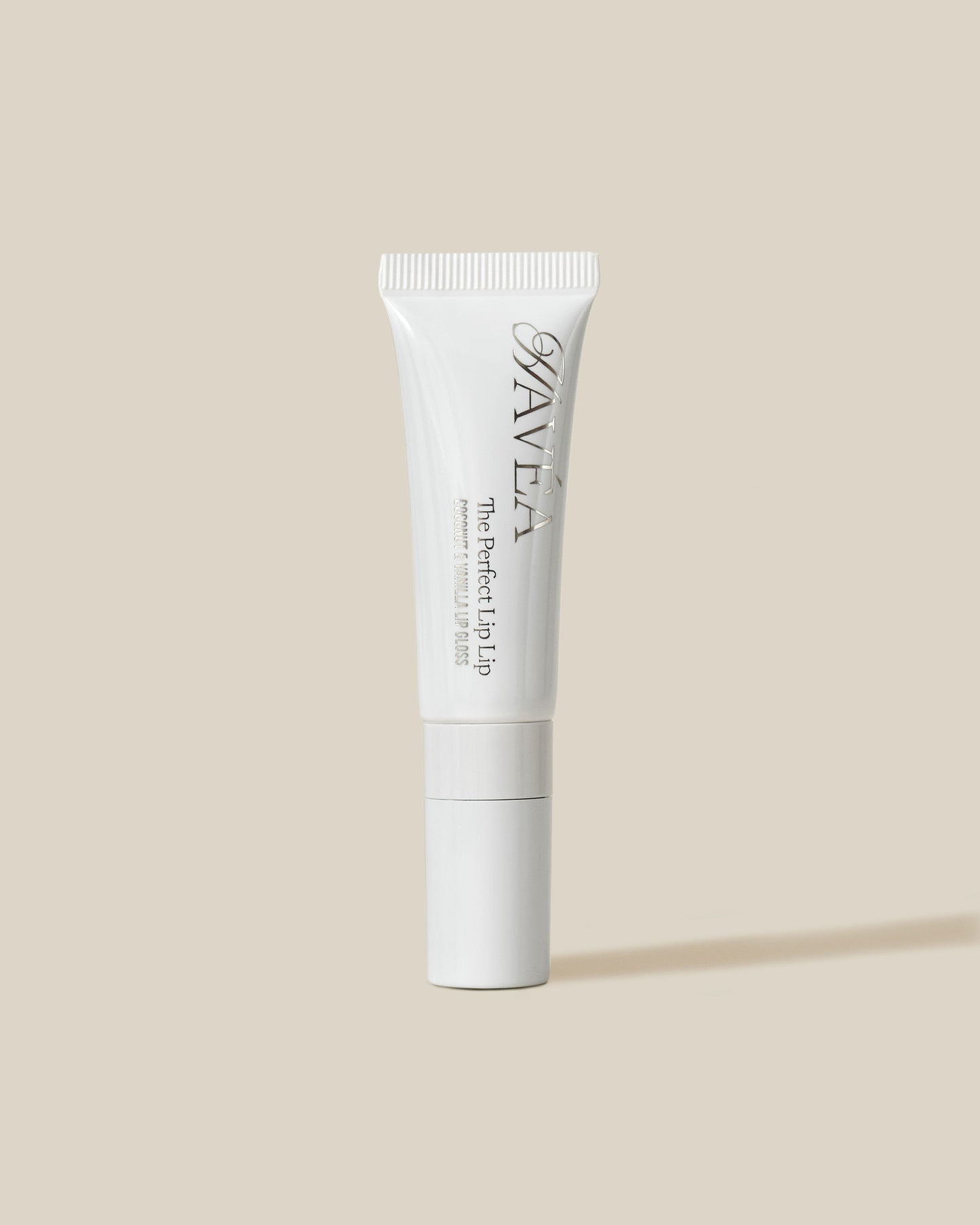 White cosmetic tube with Havéa branding on a beige background