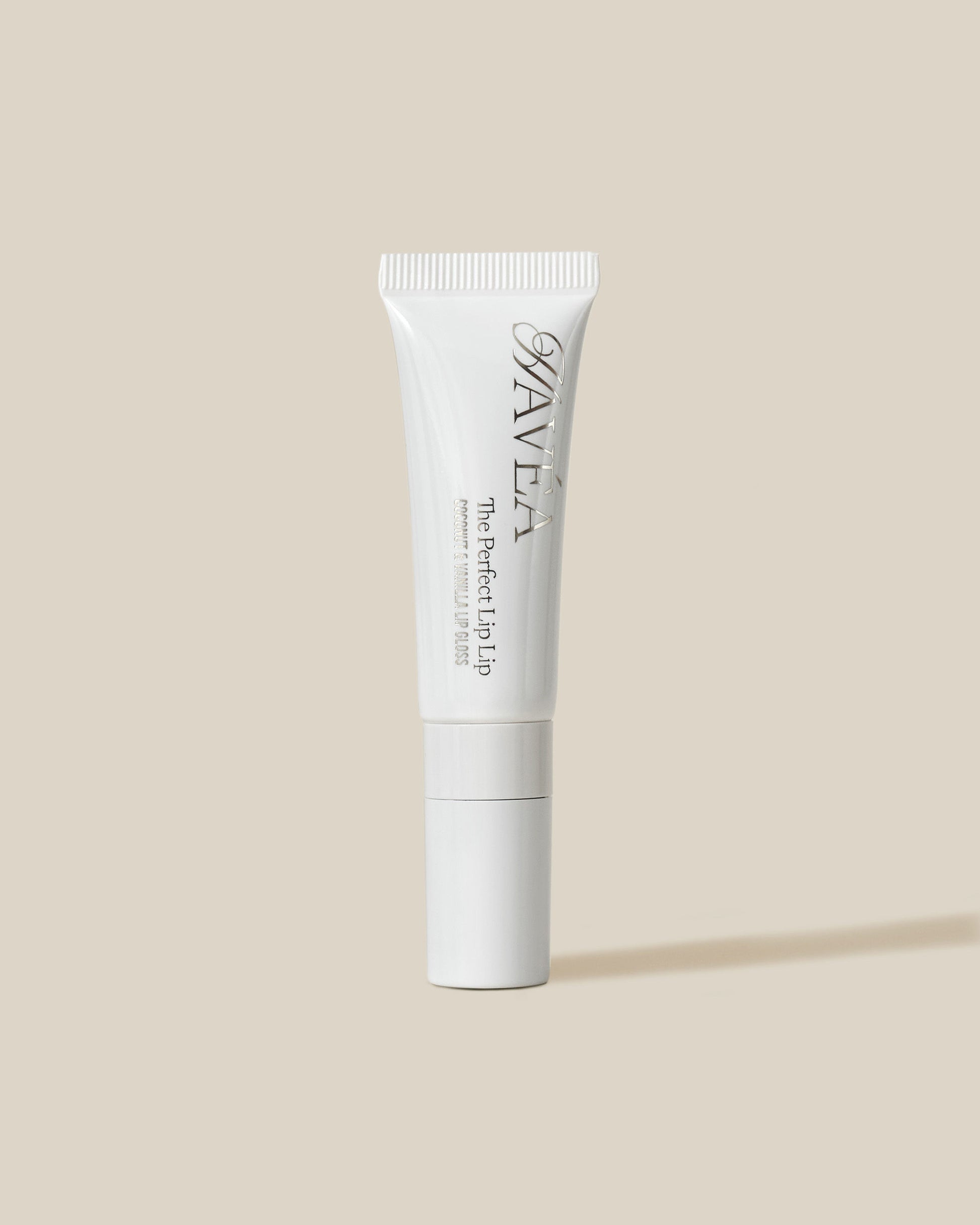 White cosmetic tube with Havéa branding on a beige background