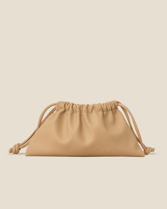 Beige drawstring pouch with 'Havéa' branding on a beige background