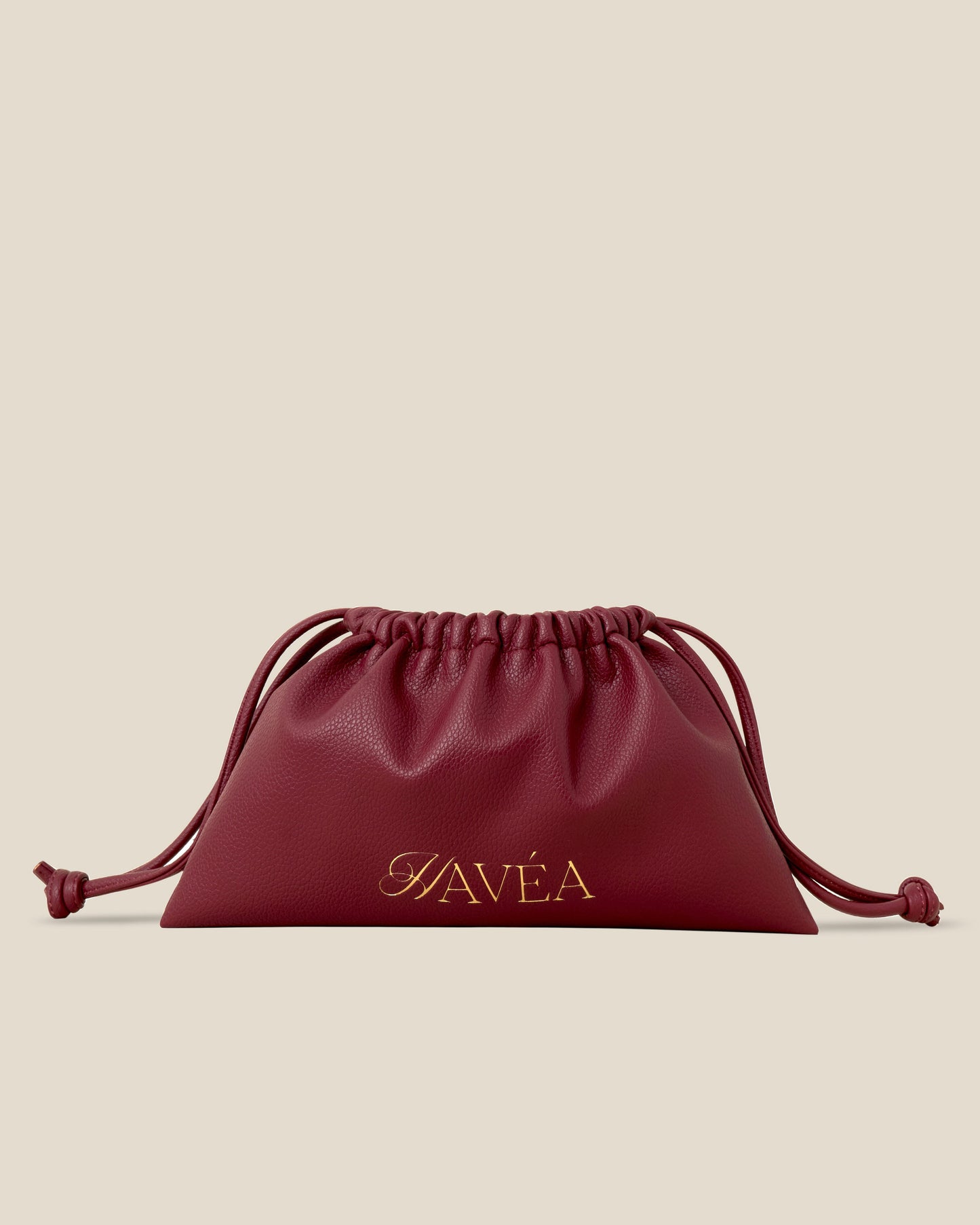 Red drawstring pouch with 'Havéa' branding on a beige background